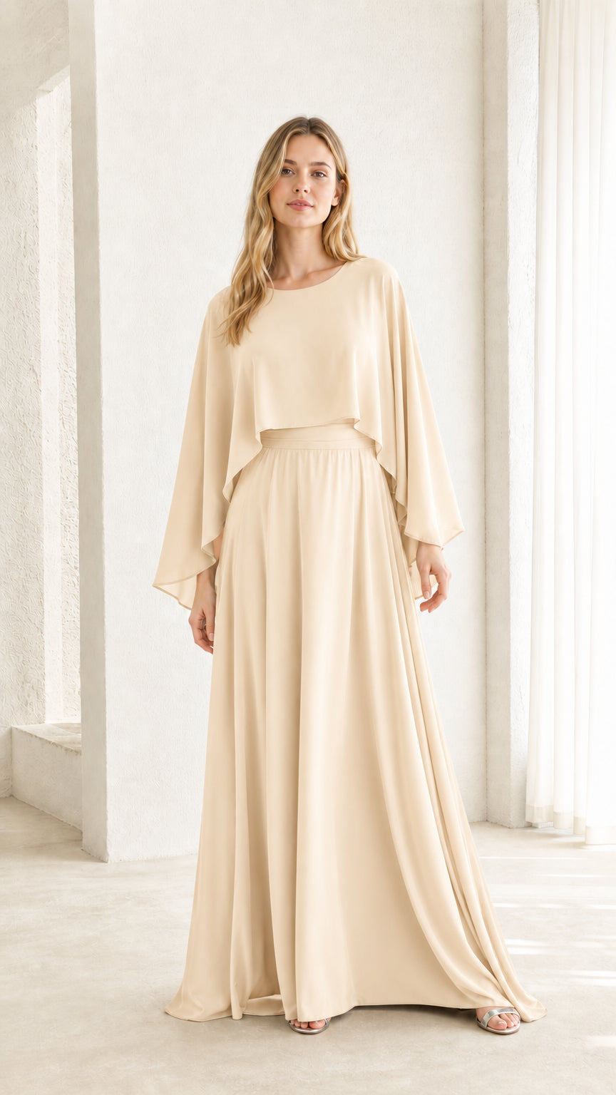 Woman wearing beige cape overlay maxi dress