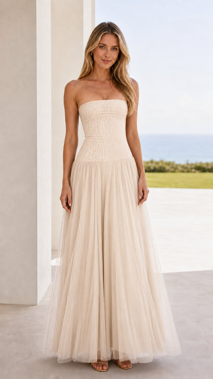Front view of champagne strapless ruched tulle maxi dress