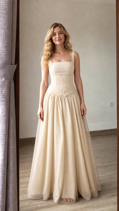 Front view of champagne beige corset-style long tulle evening gown