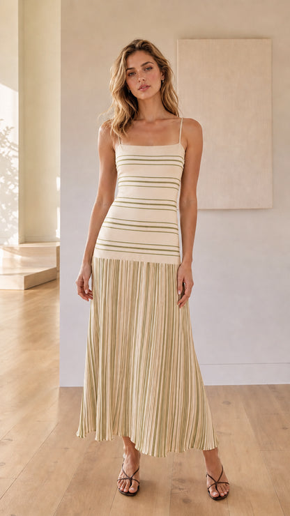 Woman wearing beige striped knit maxi dress