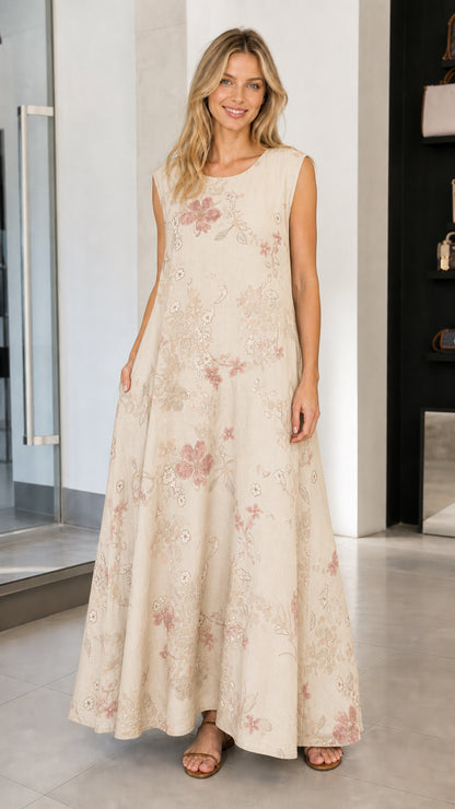 Model wearing beige floral sleeveless maxi dress