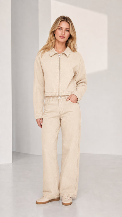 Woman wearing beige denim jacket and wide-leg pants set