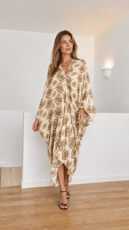 Model wearing beige paisley kaftan dress