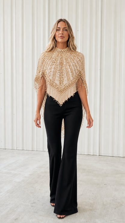 Front view of model wearing champagne gold beaded fringe evening capelet