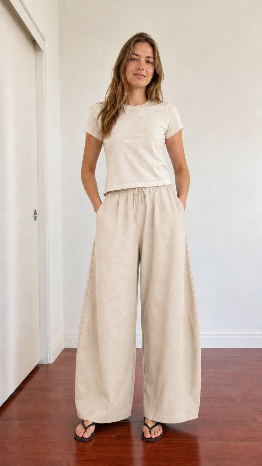 Full-body outfit showing beige cream wide leg lounge pants with ivory t-shirt