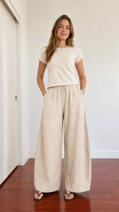 Full-body outfit showing beige cream wide leg lounge pants with ivory t-shirt