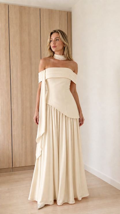 Model wearing champagne off-the-shoulder maxi dress