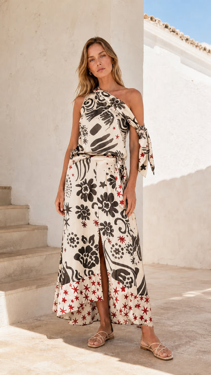 Model wearing cream print one-shoulder maxi dress