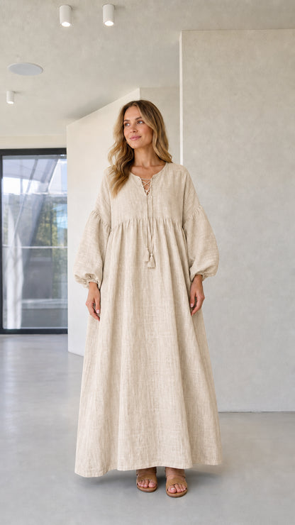 Model wearing natural beige relaxed boho caftan maxi dress