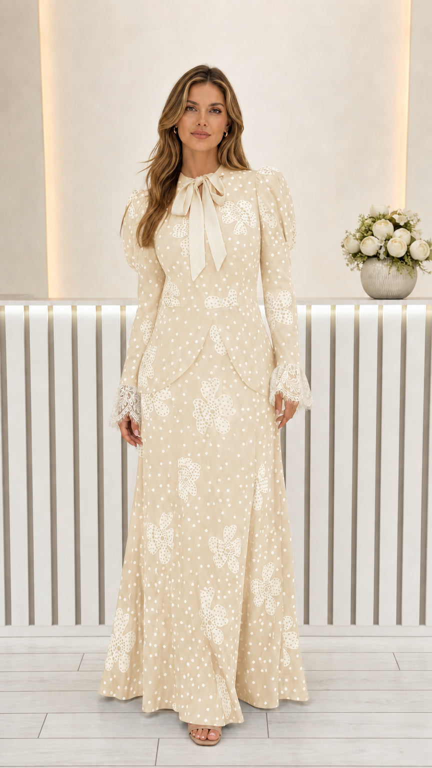 Front view of beige cream floral polka dot long sleeve maxi dress with contrast bow