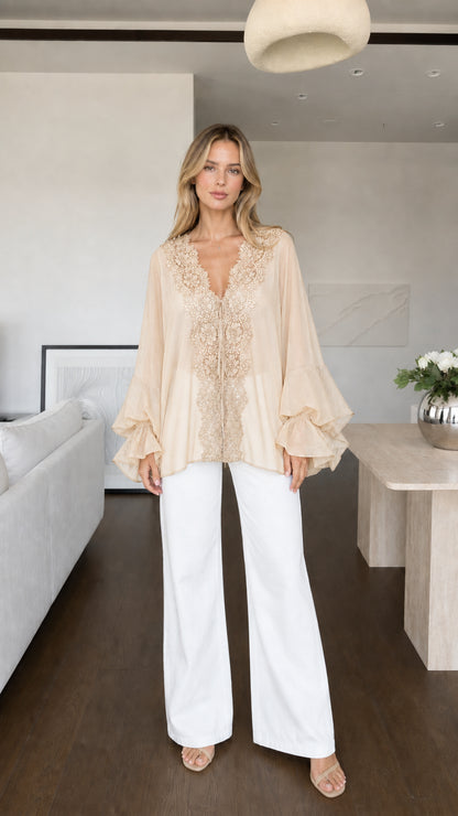 Model wearing beige boho lace trim blouse front view