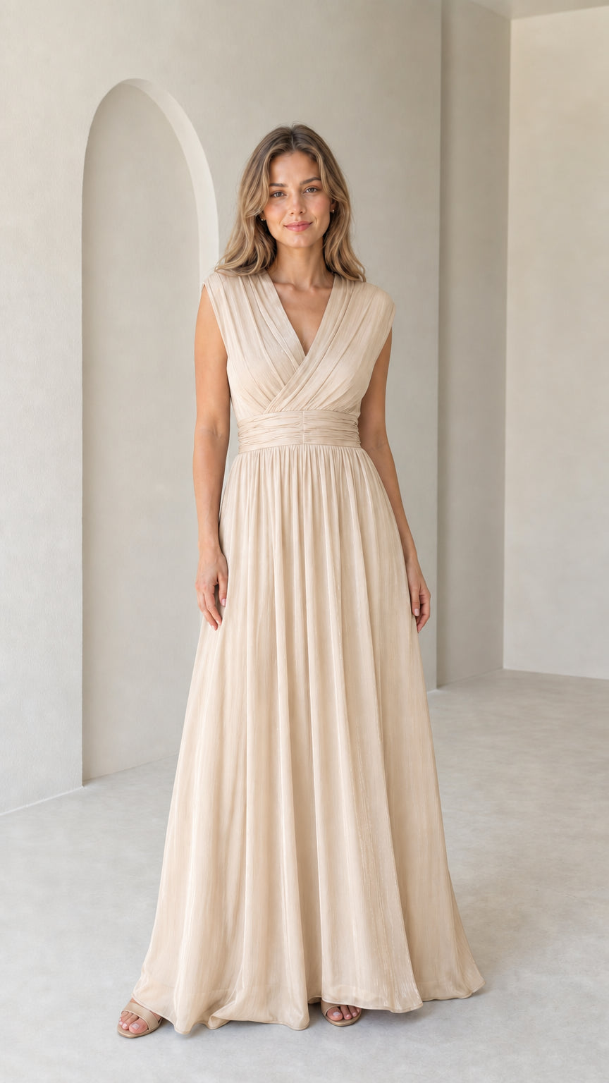 Model wearing champagne cream pleated sleeveless evening maxi dress