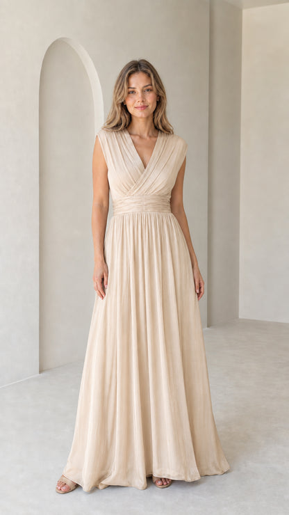 Model wearing champagne cream pleated sleeveless evening maxi dress