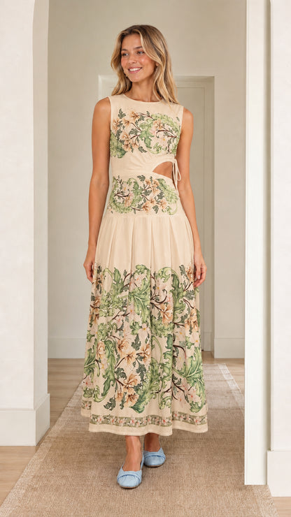 Woman wearing beige floral print cutout maxi dress