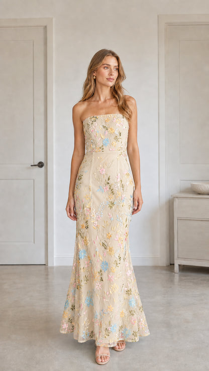 Front view of champagne floral embroidered strapless maxi dress