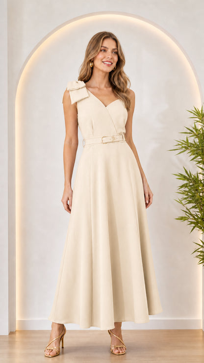 Woman wearing cream bow shoulder maxi dress