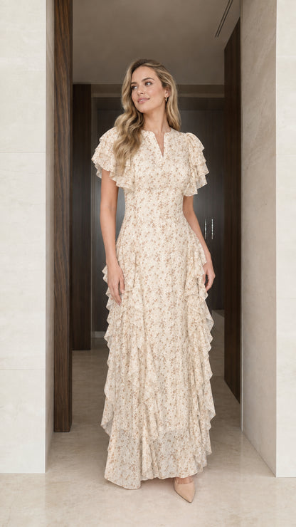 Model wearing cream floral ruffle maxi dress