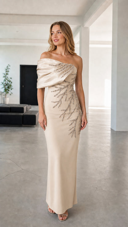 Full-length view of champagne asymmetric draped beaded evening maxi gown