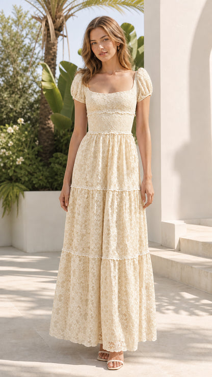 Model wearing cream floral lace maxi dress