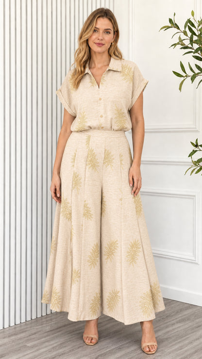 Model wearing beige leaf print two piece set
