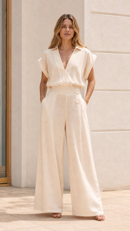 Woman wearing cream wide-leg jumpsuit
