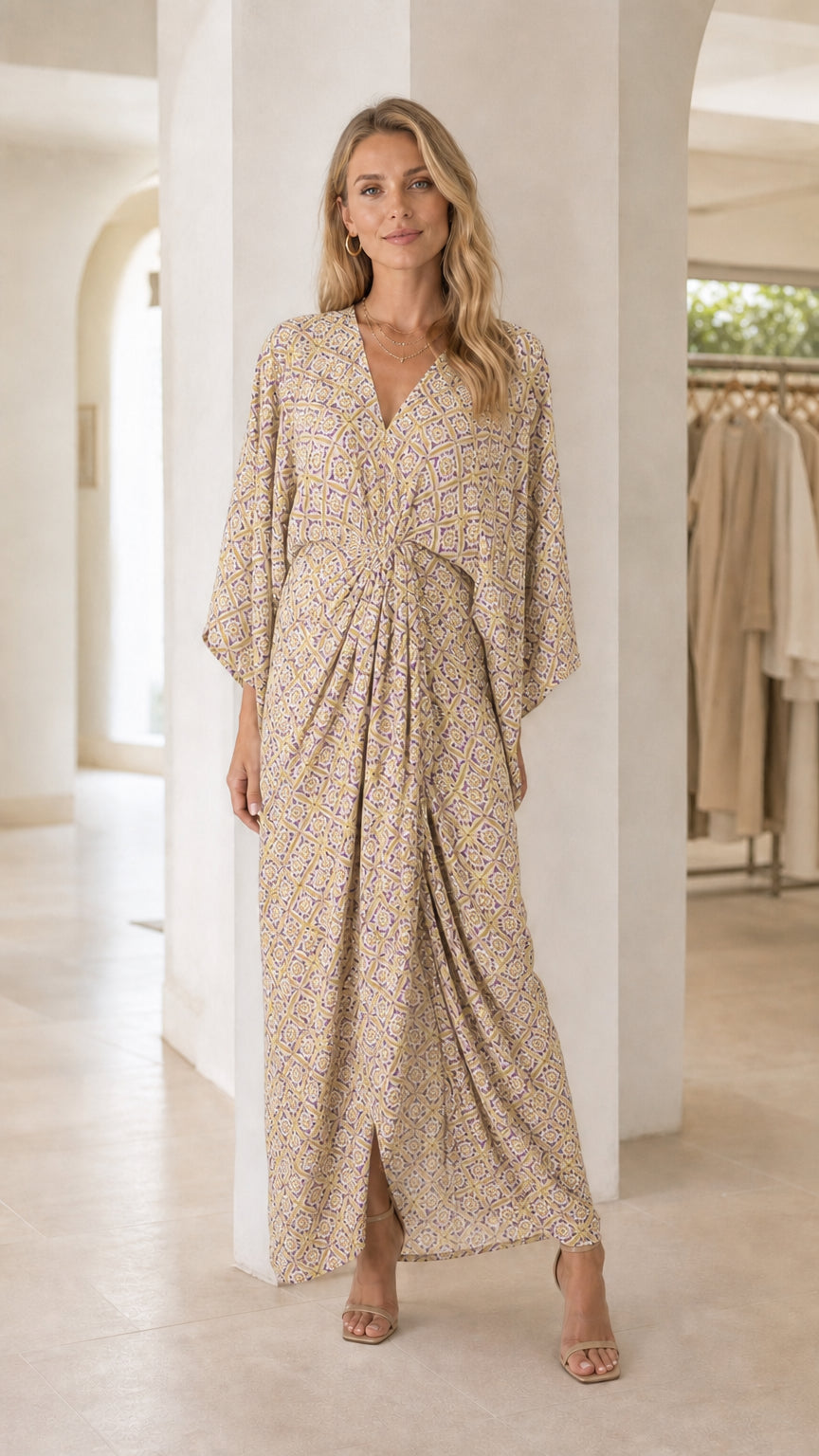 Model wearing beige printed V-neck maxi dress