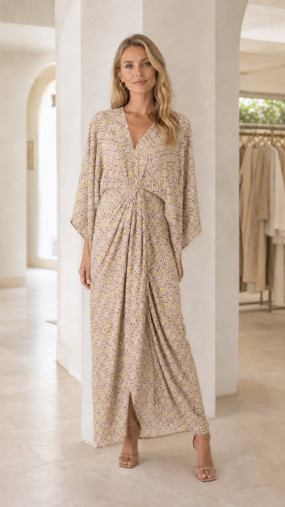Model wearing beige printed V-neck maxi dress