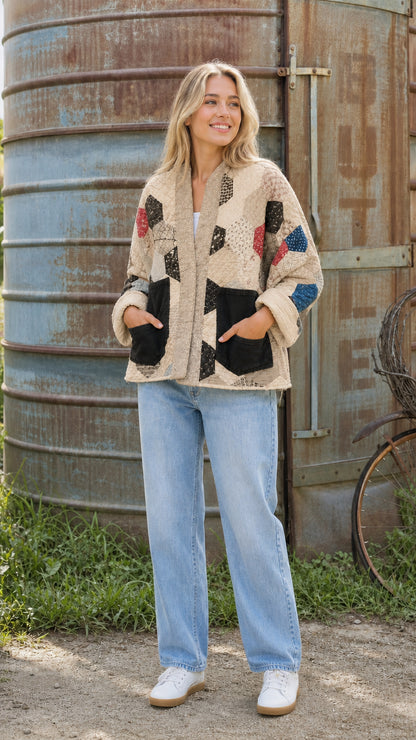 Tan hexagon patchwork quilted jacket on model