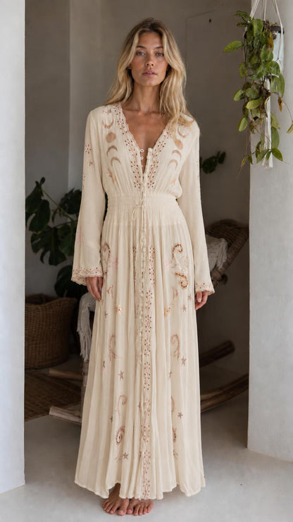 Front view of model wearing beige celestial embroidered maxi dress