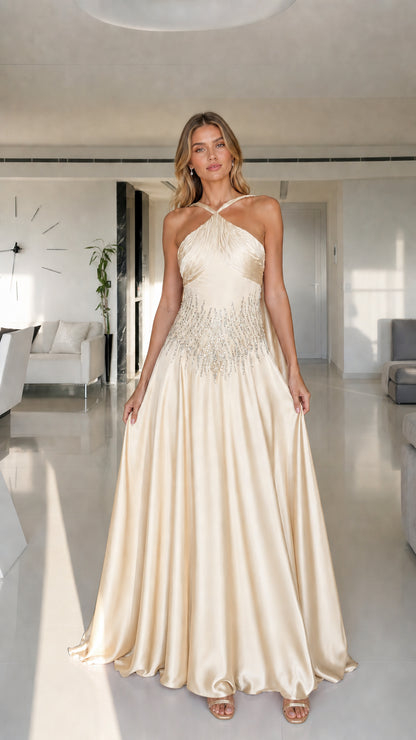 Model wearing champagne halter neck satin maxi dress