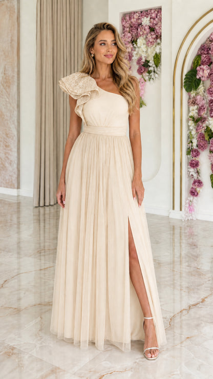 Front view of champagne one-shoulder lace ruffle tulle maxi dress