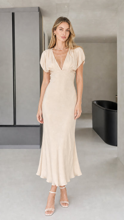 Front view of model wearing champagne midi dress