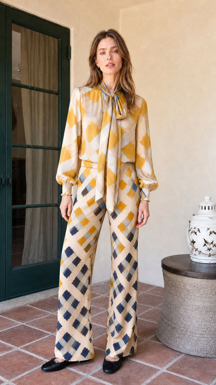 Model wearing cream colorway of the plaid matching set