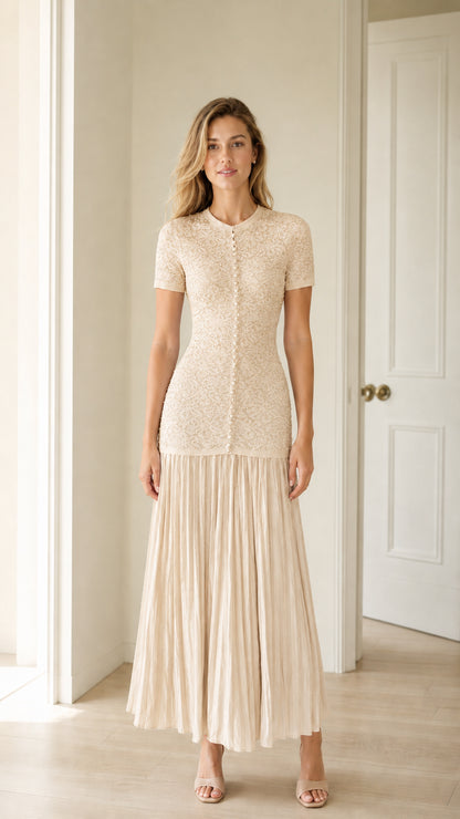 Front view of champagne pearl button knit bodice pleated midi dress