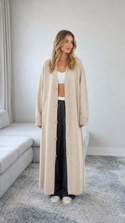 Front view of model wearing a Beige oatmeal floor length maxi duster cardigan