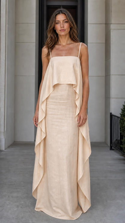 Model wearing the beige color variant of the flowing overlay maxi dress