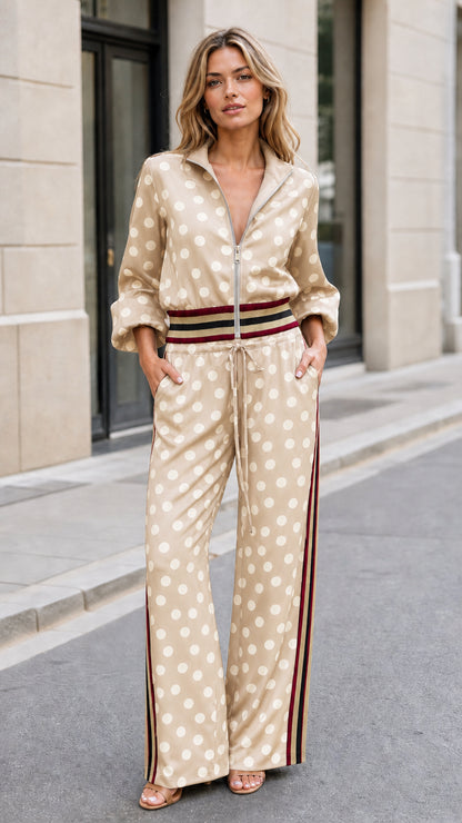 Full front view of woman wearing beige polka dot matching jacket and wide-leg pant set