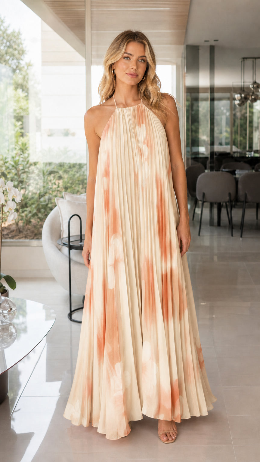 Woman wearing beige floral pleated maxi dress