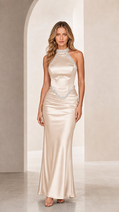 Front view of champagne satin halter neck evening gown with rhinestone trim