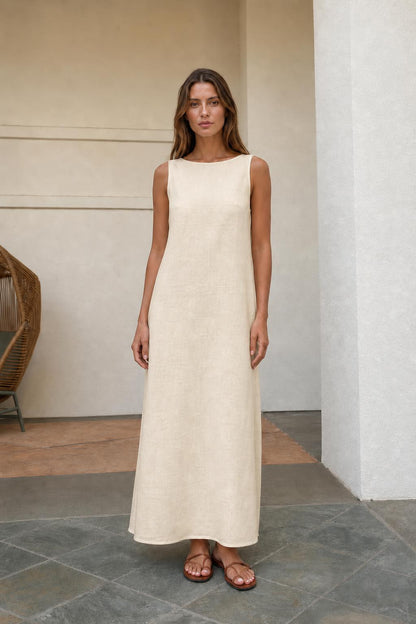 Woman wearing beige sleeveless maxi dress