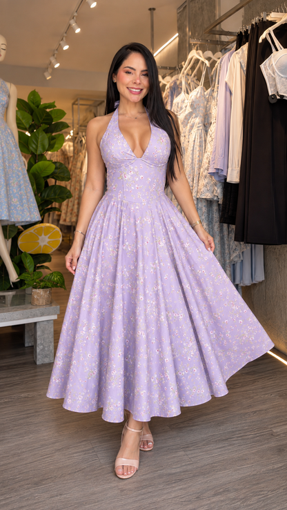 Woman wearing lavender floral halter midi dress